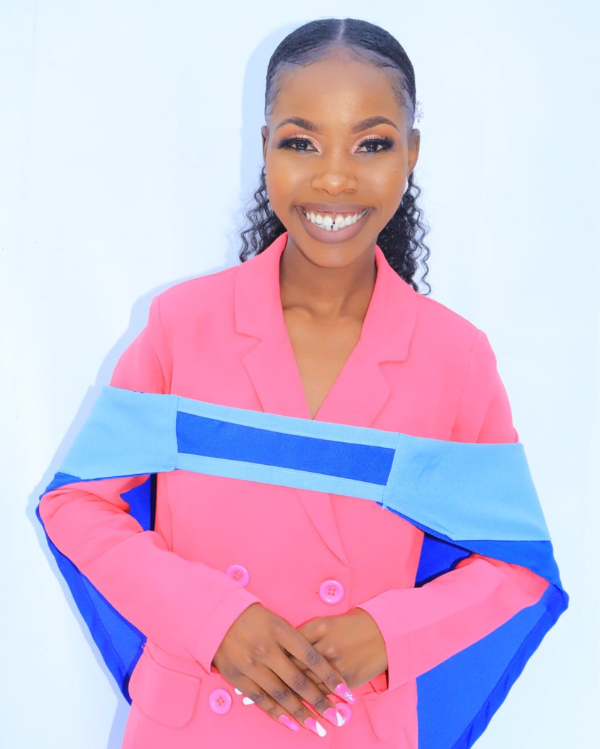 Ndaedzo Matodzi in a pink and blue blazer, smiling.